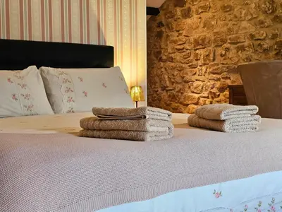 Un ou plusieurs lits dans un hébergement de l'établissement Le Cosy - Domaine du Vertendre