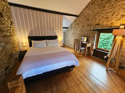 Un ou plusieurs lits dans un hébergement de l'établissement Le Cosy - Domaine du Vertendre