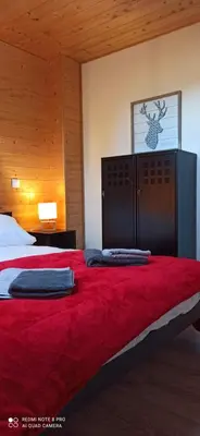 Un ou plusieurs lits dans un hébergement de l'établissement Chalet Pom'Pin