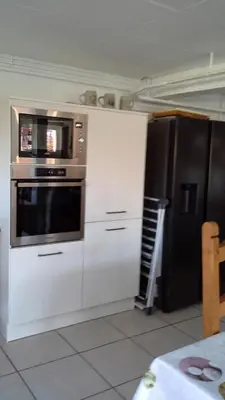 Cuisine ou kitchenette dans l'établissement la maison bonheur