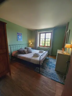 Un ou plusieurs lits dans un hébergement de l'établissement Chambre d'hôtes Le Puy Maury