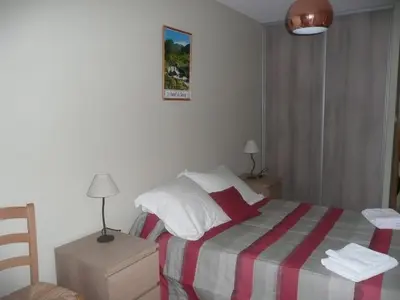 Un ou plusieurs lits dans un hébergement de l'établissement Residence L'Etoile du Sancy