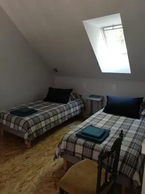 Un ou plusieurs lits dans un hébergement de l'établissement Les Perluètes - Chambres d'hôtes