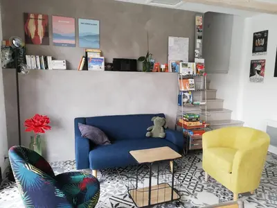Coin salon dans l'établissement Les Perluètes - Chambres d'hôtes