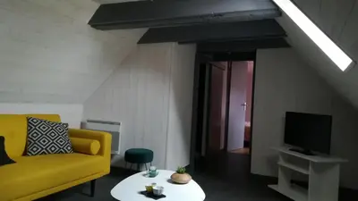 Télévision ou salle de divertissement dans l'établissement Chez Mamie