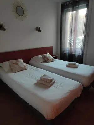 Un ou plusieurs lits dans un hébergement de l'établissement Hotel Au Val Doré