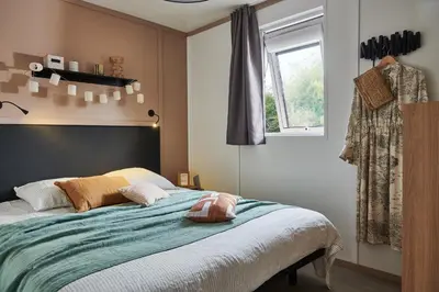 Un ou plusieurs lits dans un hébergement de l'établissement Camping les Campagnes