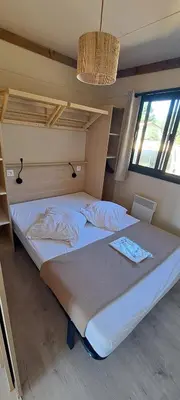 Un ou plusieurs lits dans un hébergement de l'établissement Camping les Campagnes