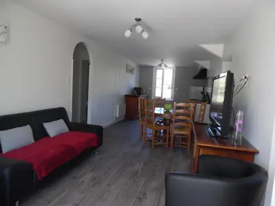 Coin salon dans l'établissement Maison de Vacances Le Ranfort