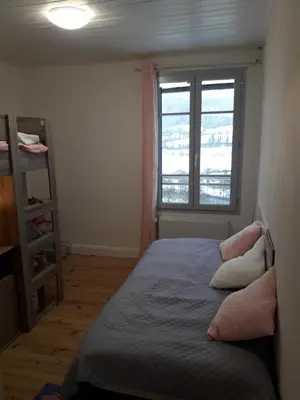 Un ou plusieurs lits dans un hébergement de l'établissement maison cosy proche de la station de ski du lioran 4 personnes