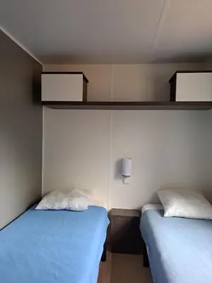 Un ou plusieurs lits dans un hébergement de l'établissement Camping Le Soulhol