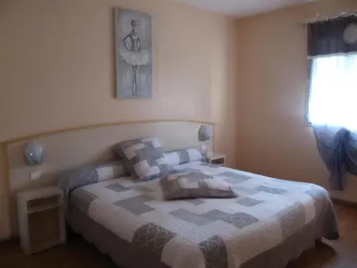 Un ou plusieurs lits dans un hébergement de l'établissement Hôtel Le Colombier