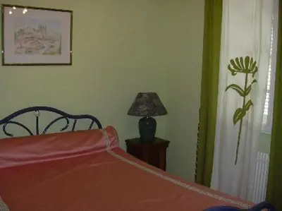 Un ou plusieurs lits dans un hébergement de l'établissement Chambres d'Hôtes à la Fontanille
