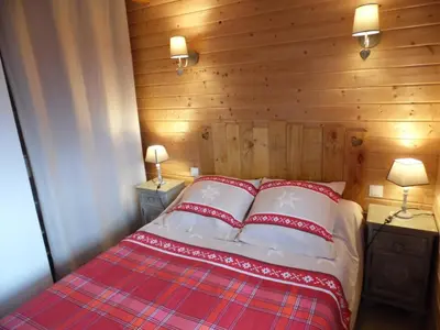 Un ou plusieurs lits dans un hébergement de l'établissement Chalet des Clarines