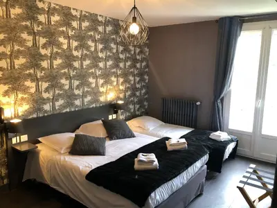 Un ou plusieurs lits dans un hébergement de l'établissement Logis Hôtel Auberge de L'Etang