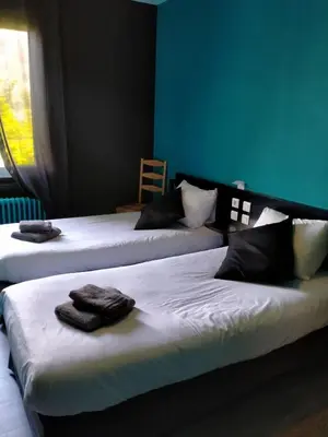 Un ou plusieurs lits dans un hébergement de l'établissement Logis Hôtel Auberge de L'Etang
