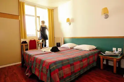 Un ou plusieurs lits dans un hébergement de l'établissement VTF Le Domaine des Puys