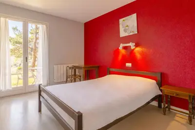 Un ou plusieurs lits dans un hébergement de l'établissement Azureva Club Murol