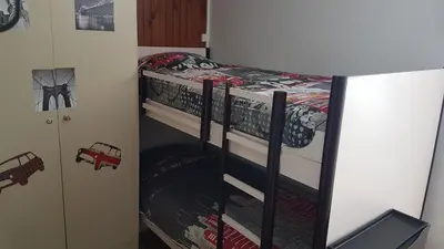 Un ou plusieurs lits dans un hébergement de l'établissement Studio-cabine au pied des pistes à Super Besse