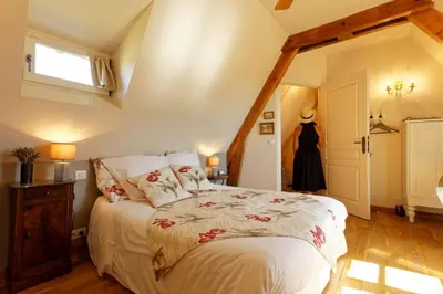Un ou plusieurs lits dans un hébergement de l'établissement La Bruyle - Chambre d'hôtes de charme