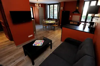 Coin salon dans l'établissement Appartement Charlannes