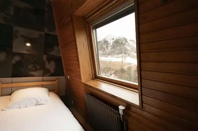 Un ou plusieurs lits dans un hébergement de l'établissement Gîte-Hôtel Le P'tit Cham