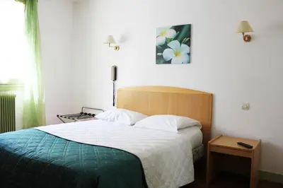Un ou plusieurs lits dans un hébergement de l'établissement Hotel Le Chapitre