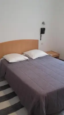 Un ou plusieurs lits dans un hébergement de l'établissement Hotel Le Chapitre