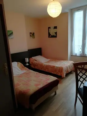 Un ou plusieurs lits dans un hébergement de l'établissement Hôtel de la Poste