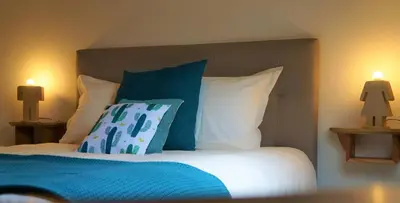 Un ou plusieurs lits dans un hébergement de l'établissement B&B Les Tranchées