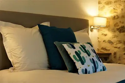Un ou plusieurs lits dans un hébergement de l'établissement B&B Les Tranchées
