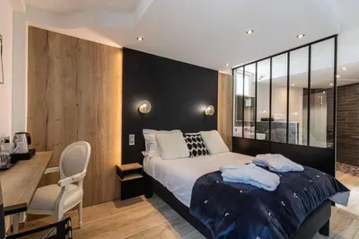 Un ou plusieurs lits dans un hébergement de l'établissement Le Bailliage Hôtel & Spa