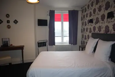 Un ou plusieurs lits dans un hébergement de l'établissement Hotel - Bistro - Bar - PMU Le Bellerive