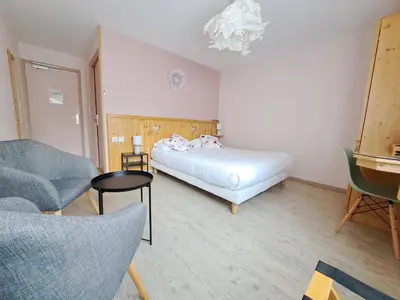 Un ou plusieurs lits dans un hébergement de l'établissement Alti'Pic Hôtel