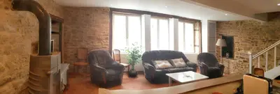 Coin salon dans l'établissement Maison charmante à La Porcherie