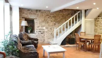 Coin salon dans l'établissement Maison charmante à La Porcherie