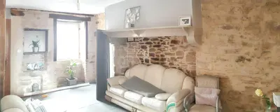 Coin salon dans l'établissement Maison charmante à La Porcherie