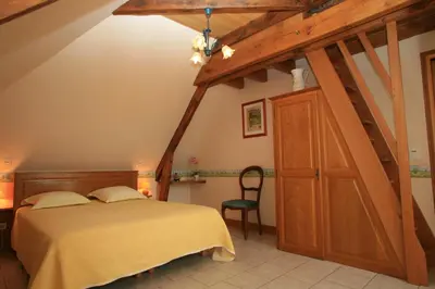 Un ou plusieurs lits dans un hébergement de l'établissement Chambres d'Hôtes Larnaudie