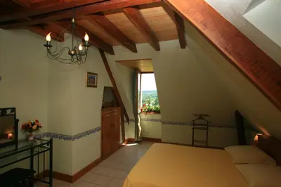 Un ou plusieurs lits dans un hébergement de l'établissement Chambres d'Hôtes Larnaudie