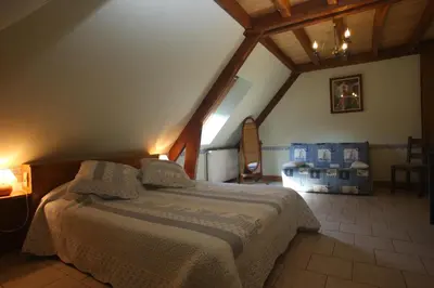 Un ou plusieurs lits dans un hébergement de l'établissement Chambres d'Hôtes Larnaudie