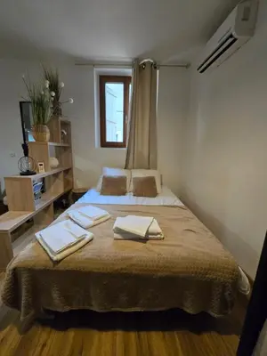 Un ou plusieurs lits dans un hébergement de l'établissement L'Appart Montignac Lascaux