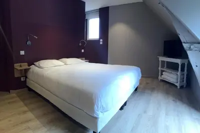 Un ou plusieurs lits dans un hébergement de l'établissement Hôtel Le Troubadour à Rocamadour