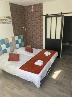 Un ou plusieurs lits dans un hébergement de l'établissement Hotel Regina