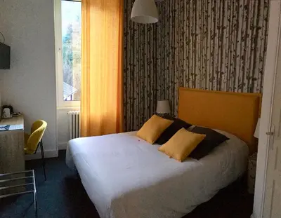 Un ou plusieurs lits dans un hébergement de l'établissement Hotel Regina