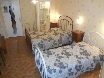 Un ou plusieurs lits dans un hébergement de l'établissement Hotel Magne