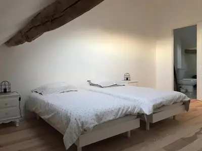 Un ou plusieurs lits dans un hébergement de l'établissement Gîte de charme Les Trois Chênes