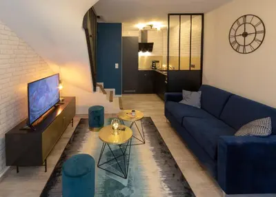 Télévision ou salle de divertissement dans l'établissement Maison de centre ville