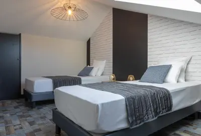 Un ou plusieurs lits dans un hébergement de l'établissement Maison de centre ville