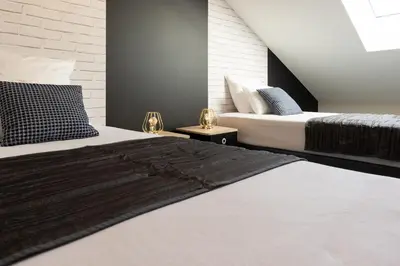 Un ou plusieurs lits dans un hébergement de l'établissement Maison de centre ville