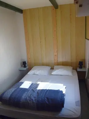 Un ou plusieurs lits dans un hébergement de l'établissement Village de Chalets de Rocamadour